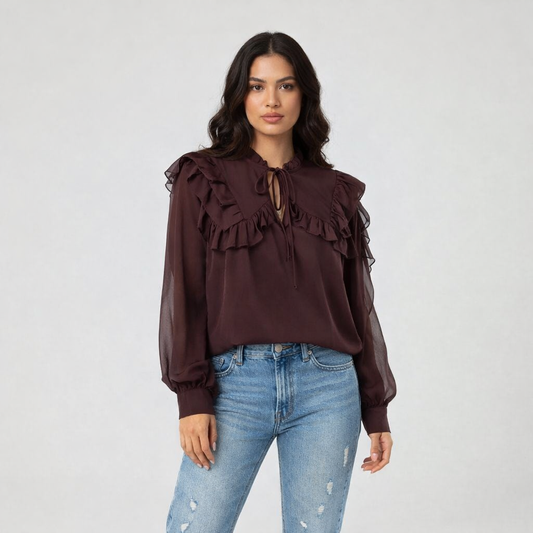 Blusa con volantes en mangas y pecho
